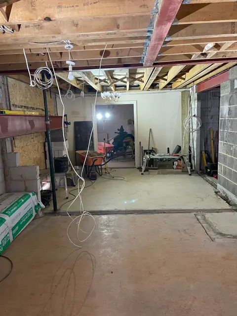 The ground floor opened up through to the next room, with steel beams and posts in the ceiling