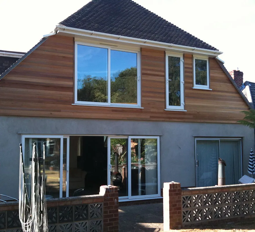 Timber clad dormer extension above bifold doors