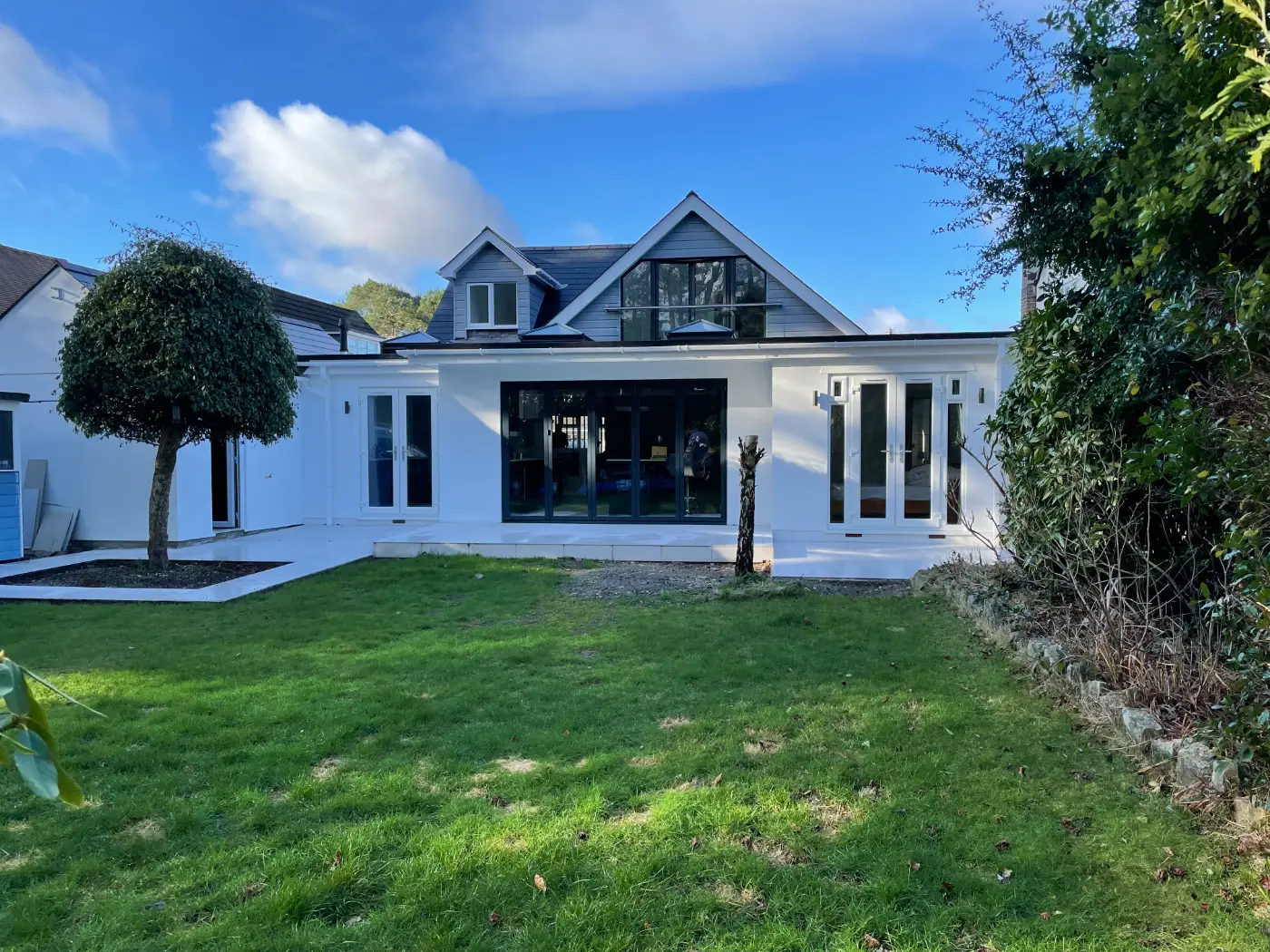 Remodelled rear elevation with a single-storey extension and bi-fold doors